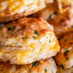 cheddar biscuit recipe with several biscuits stacked