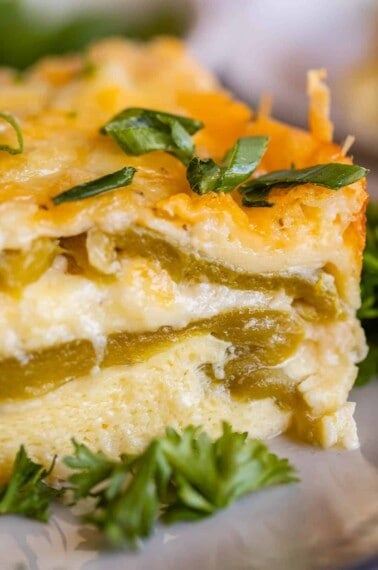 chile relleno breakfast casserole with chopped green onions on a plate