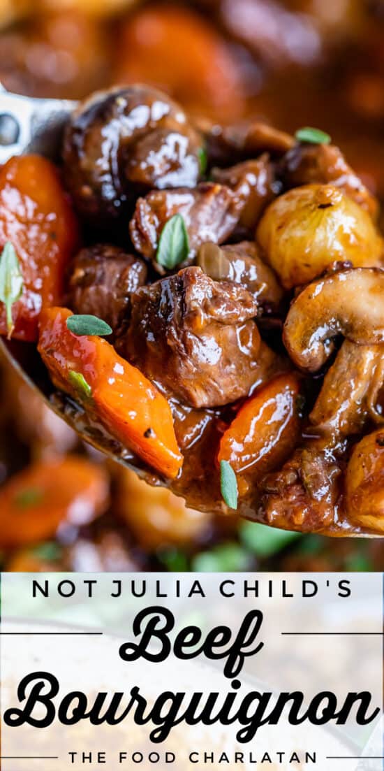 close up shot of beef bourguignon with beef, carrots, mushrooms, and onions on a spoon