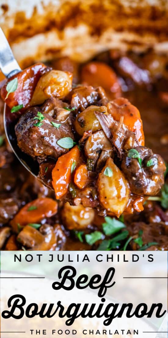 beef bourguignon with carrots, beef, mushrooms and onions on a spoon