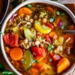 turkey vegetable soup recipe in a bowl on a wooden plate