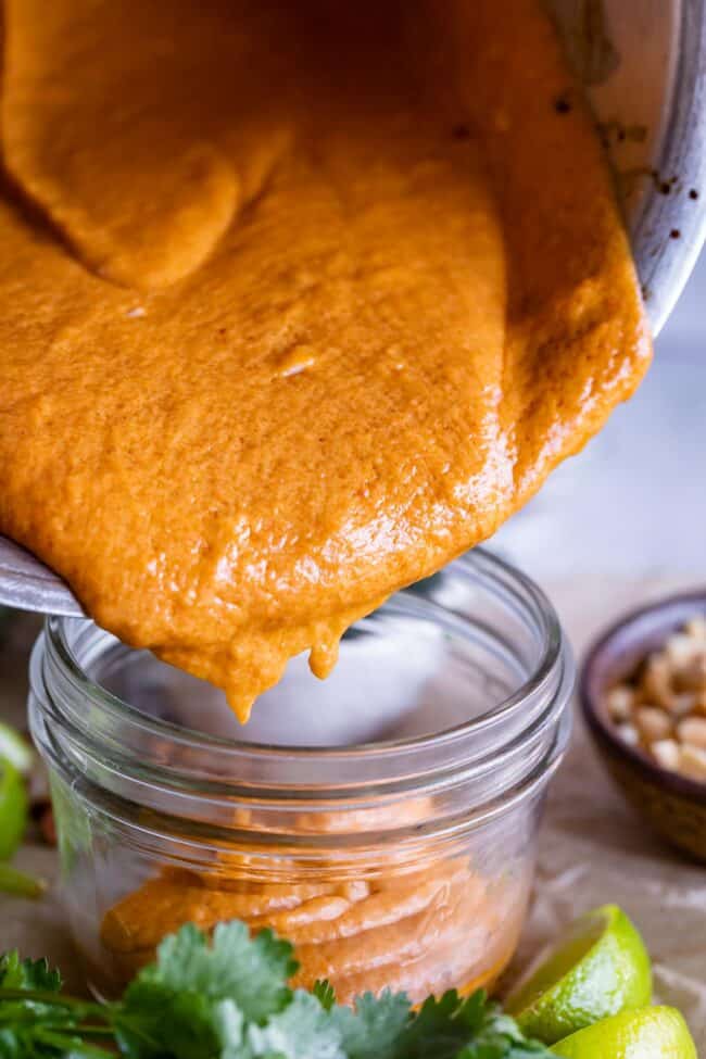 how to make Thai peanut sauce, pouring the sauce into a jar.