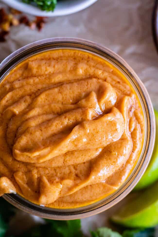 easy Thai peanut sauce piled into a jar shot from overhead.