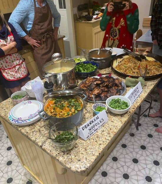 homemade Thai food set out on a kitchen island.