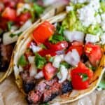 carne asada recipe in a tortilla with pico de gallo