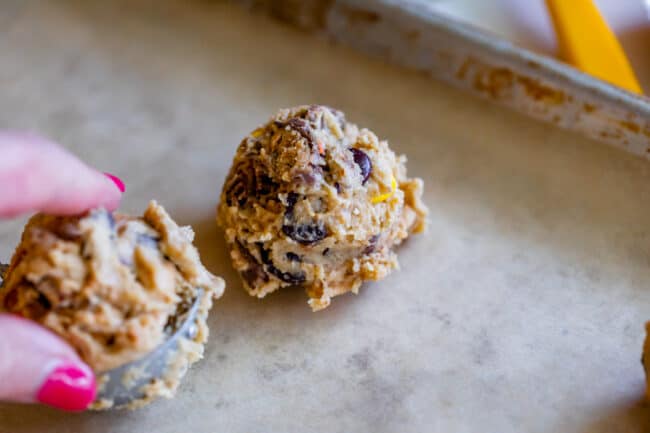 shaped peanut butter cookie dough on a parchment lined pan.