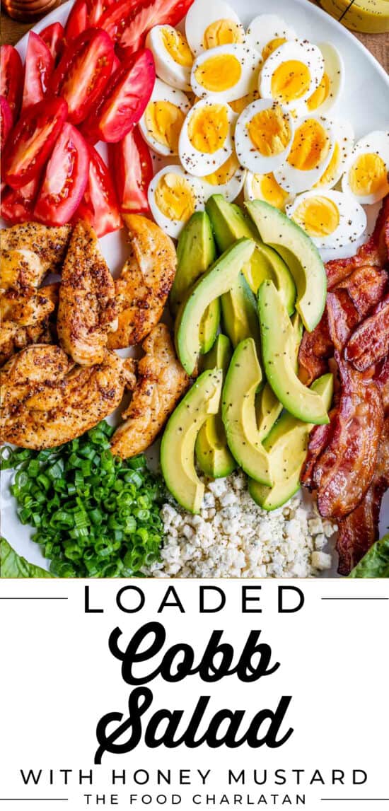 ingredients for cobb salad lined up on a white platter