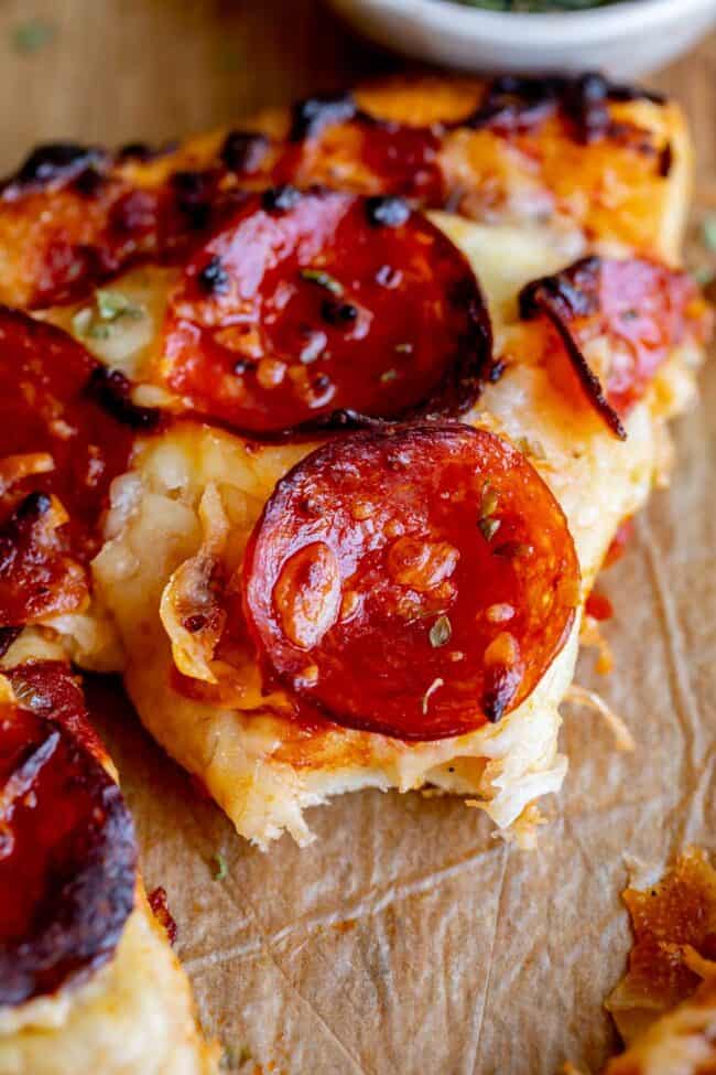bite taken out of best homemade pizza