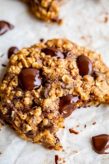 healthy cookies on a baking sheet with bite taken out