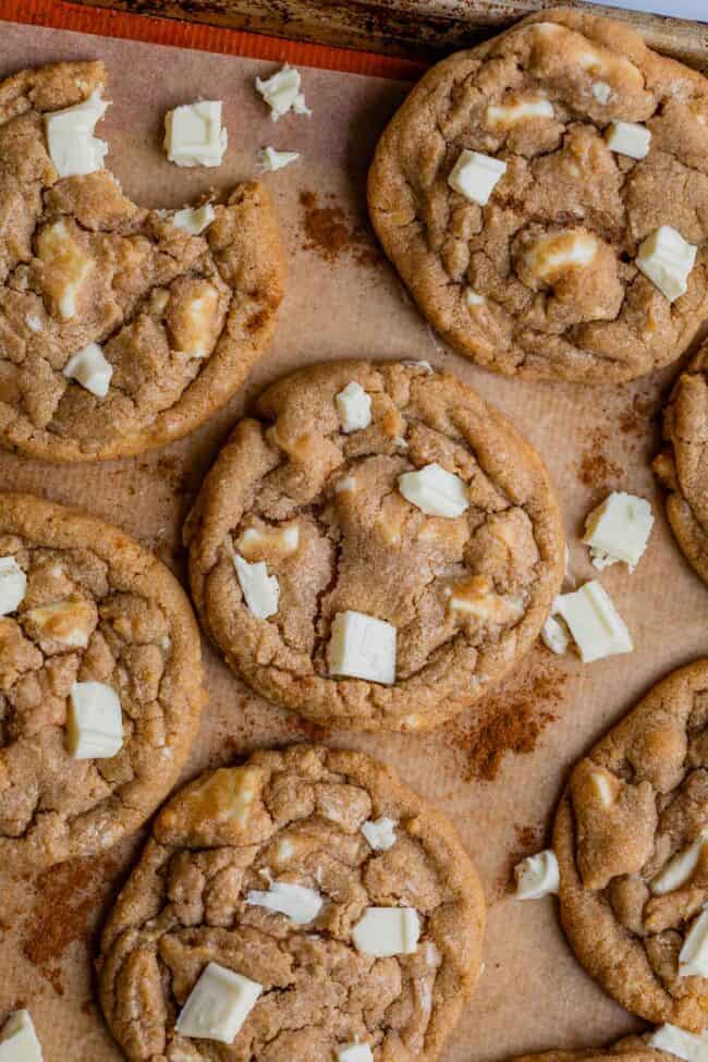 cinnamon white chocolate chip cookies on parchment paper