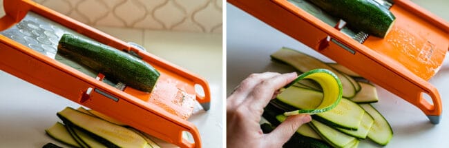 zucchini on a mandoline, bending zucchini with fingers.