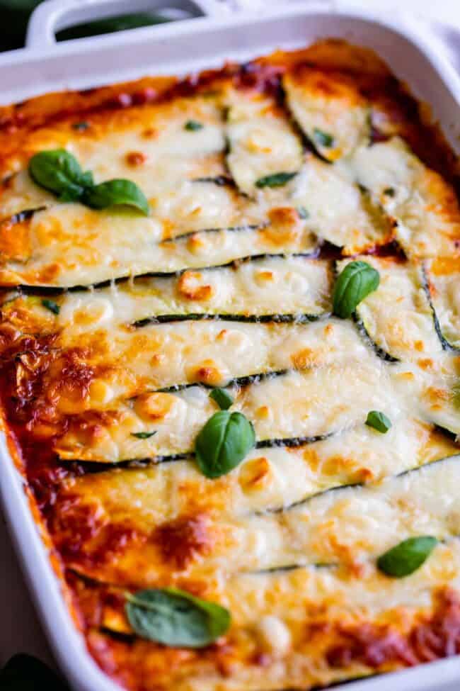 keto-friendly zucchini lasagna in a white pan. 