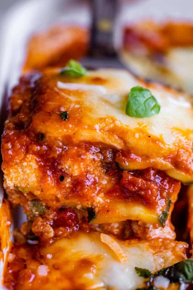 zucchini lasagna being lifted from the pan on a spatula.