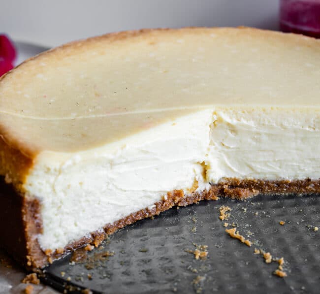 easy cheesecake in a pan with slices taken out.