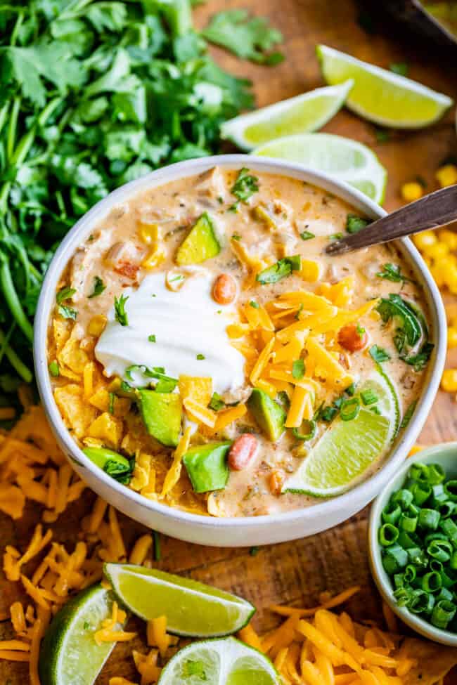 best white chicken chili in a white bowl with cilantro garnish.