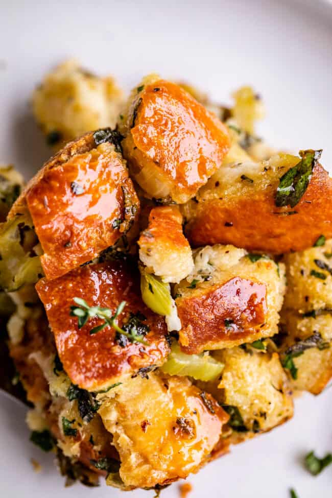 overhead shot of homemade stuffing recipe with herbs on a plate