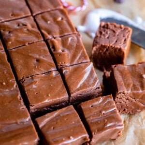 marshmallow fluff fudge cut into squares on parchment paper