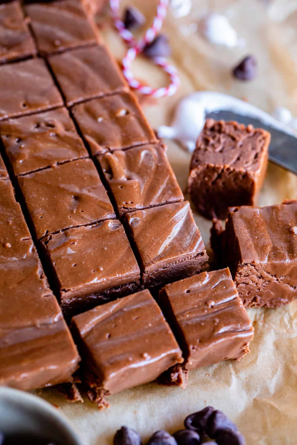 marshmallow fluff fudge cut into squares on parchment paper
