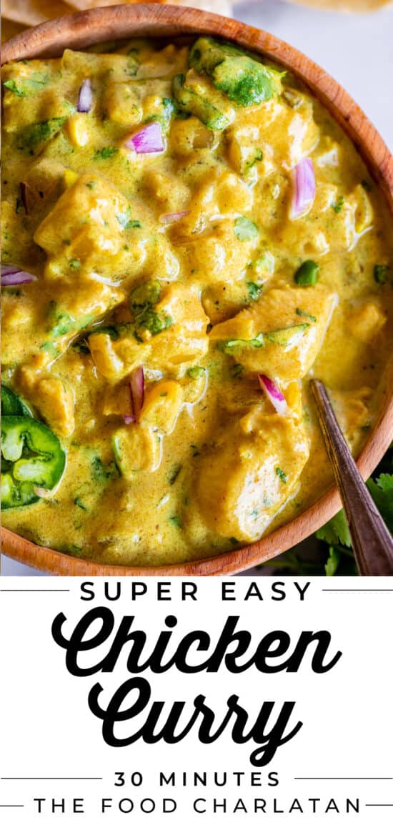 wooden bowl of easy chicken curry with spoon