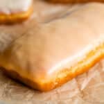 maple bar donut with glaze on parchment paper