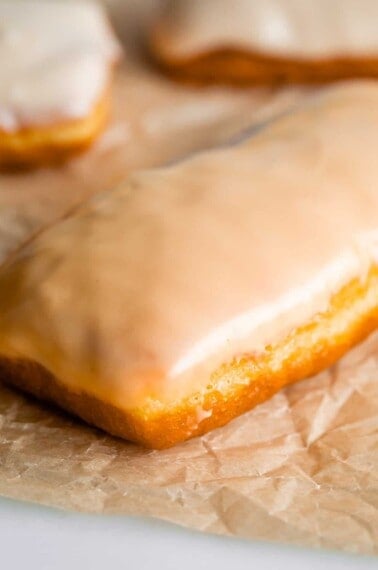 maple bar donut with glaze on parchment paper