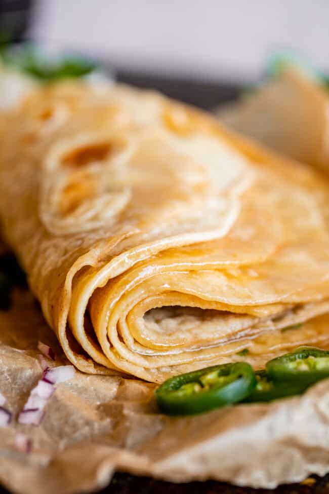 close up photo of roti Indian bread folded over.