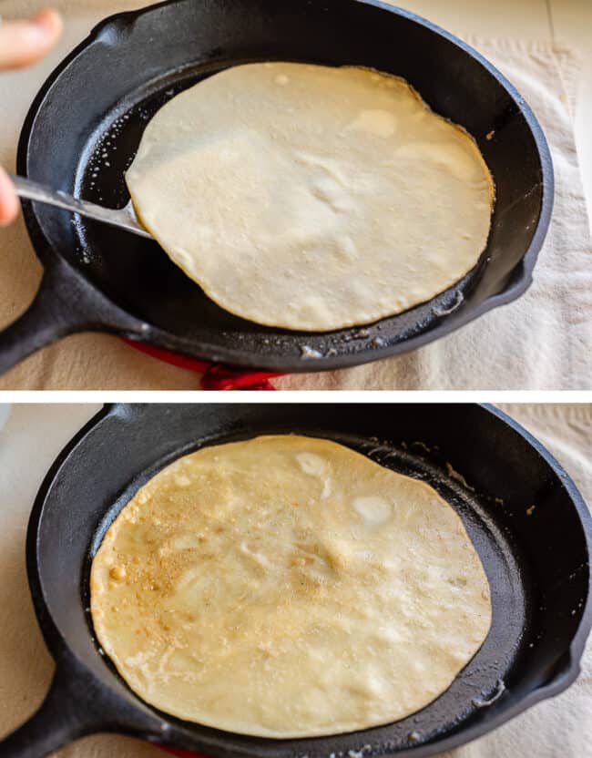 flipping raw roti bread, the bread flipped on the other side in a cast iron skillet.