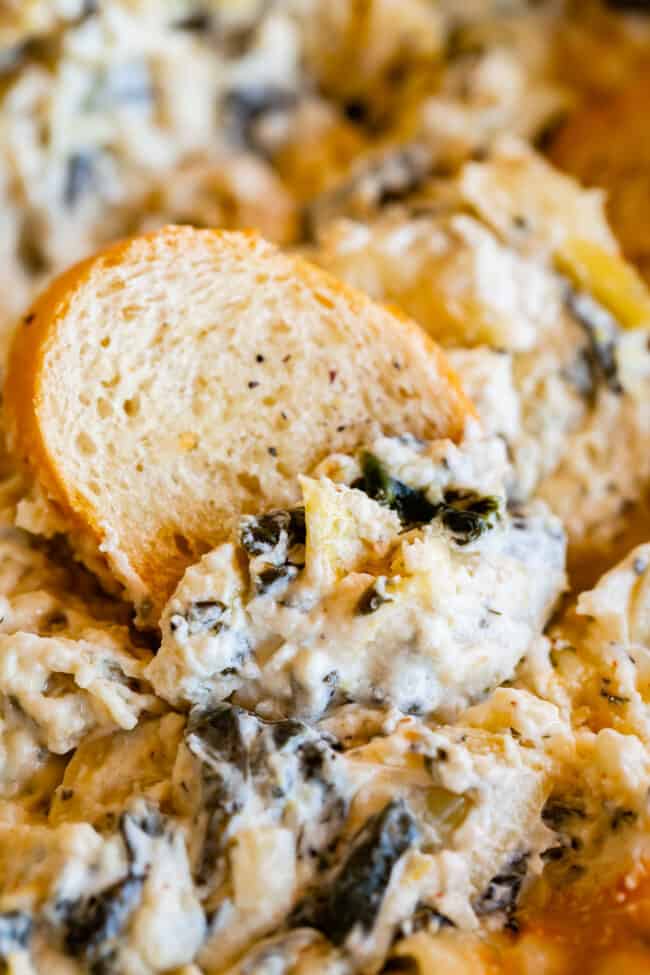 bread dipped into easy spinach artichoke dip recipe