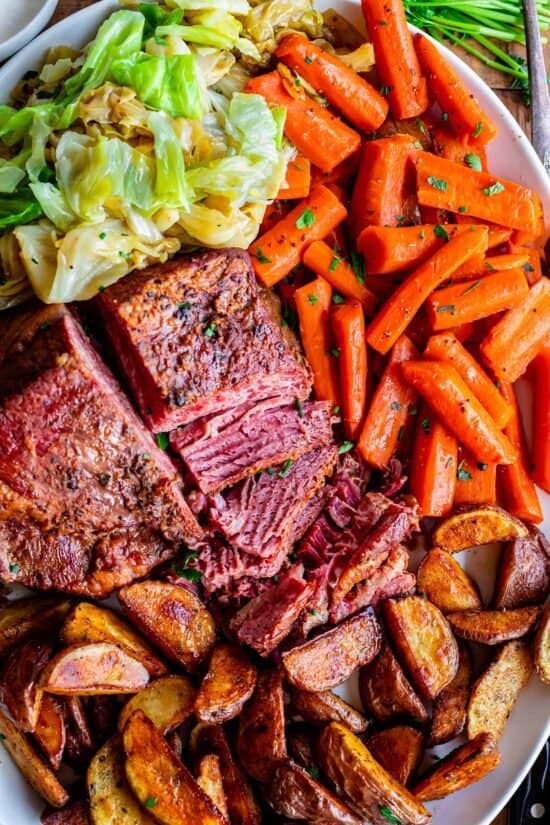 corned beef recipe with carrots, cabbage, potatoes on a platter