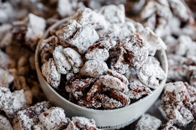 reindeer chow in a gray bowl with powdered sugar.