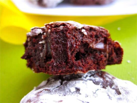 Close up of fudgy cookie with bite taken out.