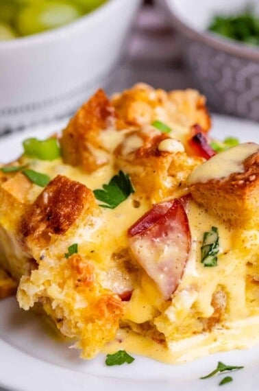 Eggs benedict bake on white plate.
