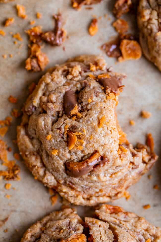 overhead shot of butterfinger baking bits cookie with a bite taken out.
