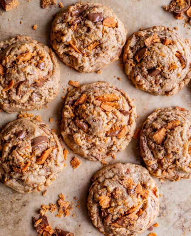 butterfinger cookies shot from overhead, on a parchment lined baking sheet.