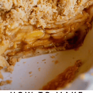 A close-up of a Dutch apple pie with a crumbly streusel topping and layered apple filling sits in a white pie dish with a portion missing. Text reads, Dutch Apple Pie Guide. The Food Charlatan.