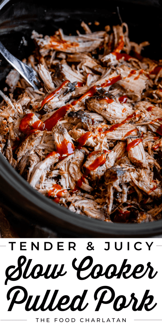 slow cooker pulled pork in a black crock pot with bbq sauce.