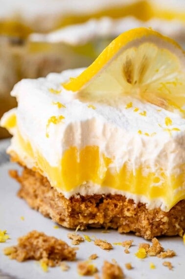 Vertical shot of lemon pudding dessert with crumbly crust.