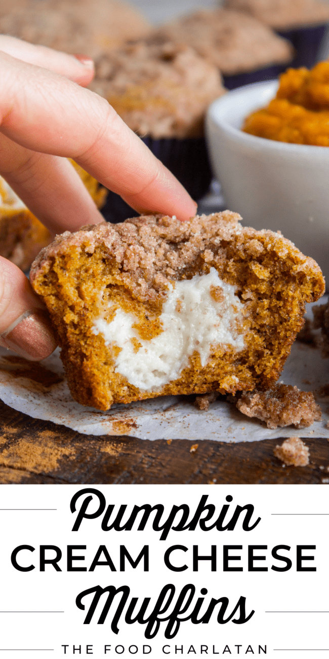 hand reaching for a cream cheese stuffed pumpkin muffin.