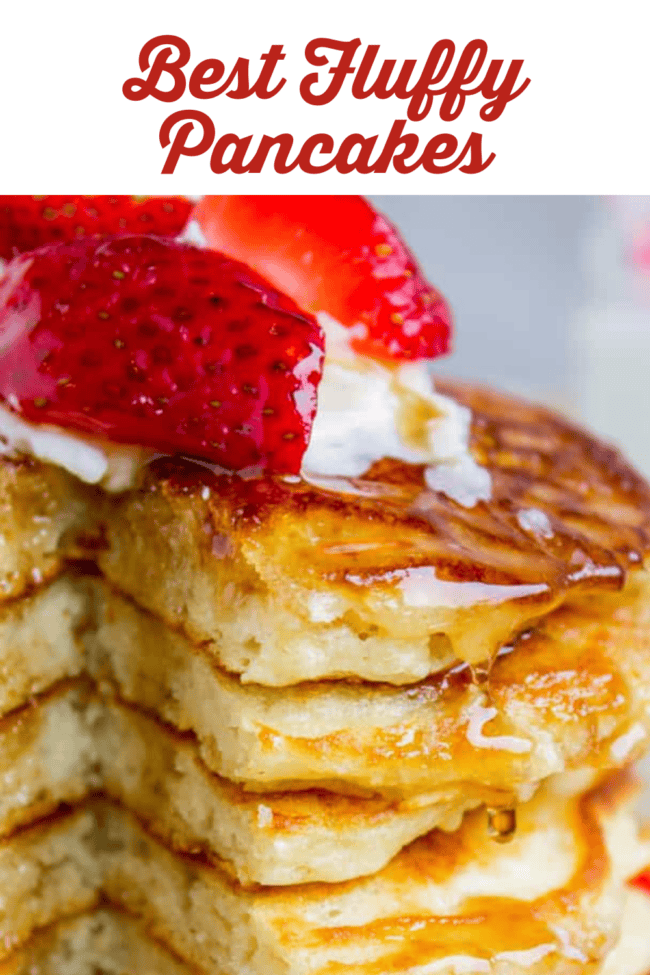 Fluffy Pancakes with strawberries and whipped cream on top