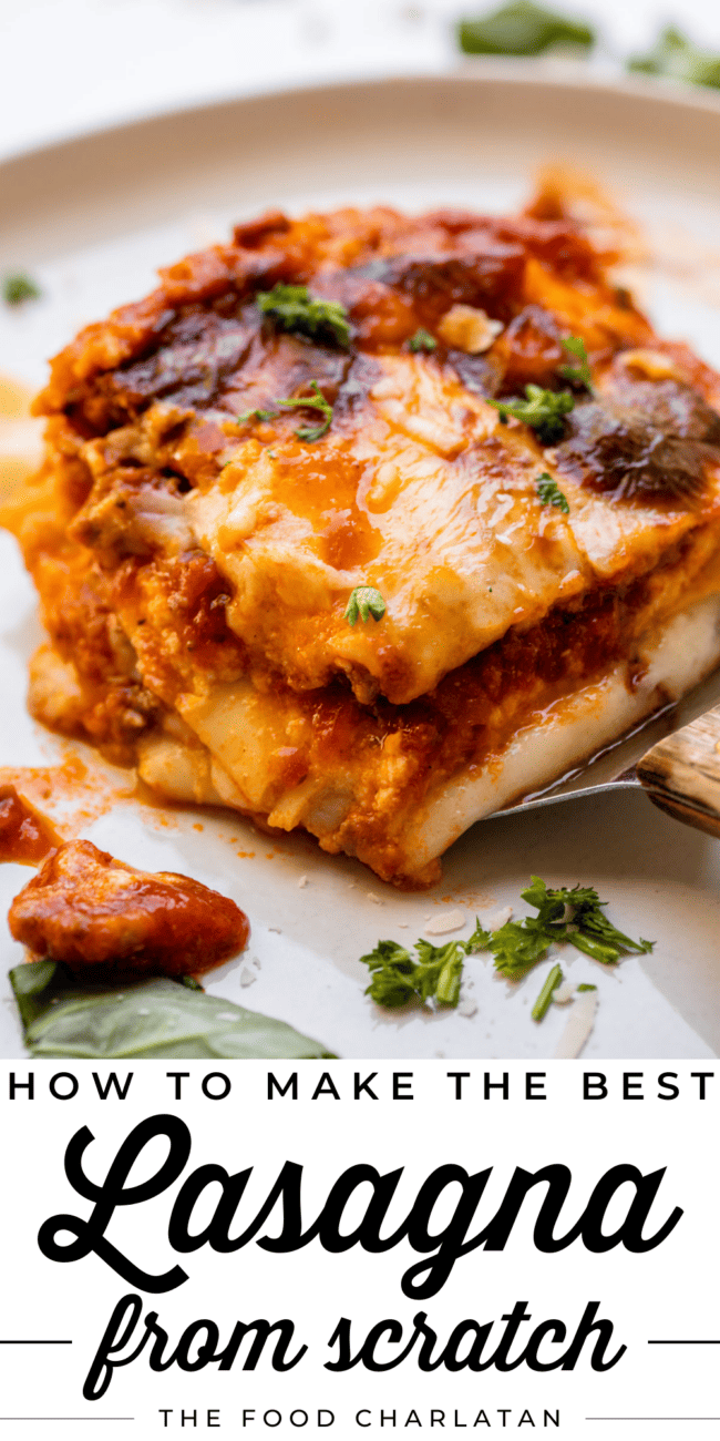 placing square of homemade lasagna on a white plate.