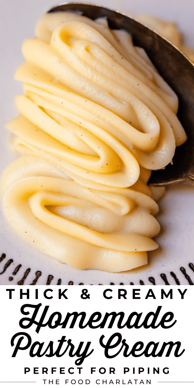 pastry cream piped onto a plate lifted with a spoon.