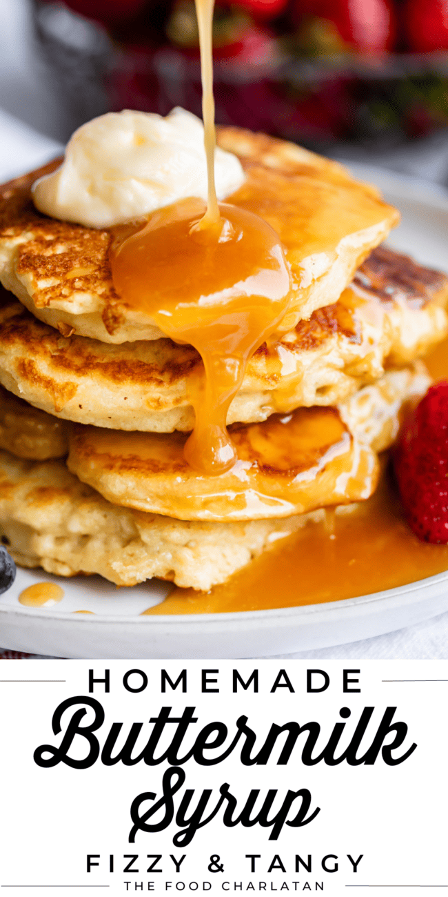 homemade buttermilk syrup being poured over a stack of pancakes on a white plate.