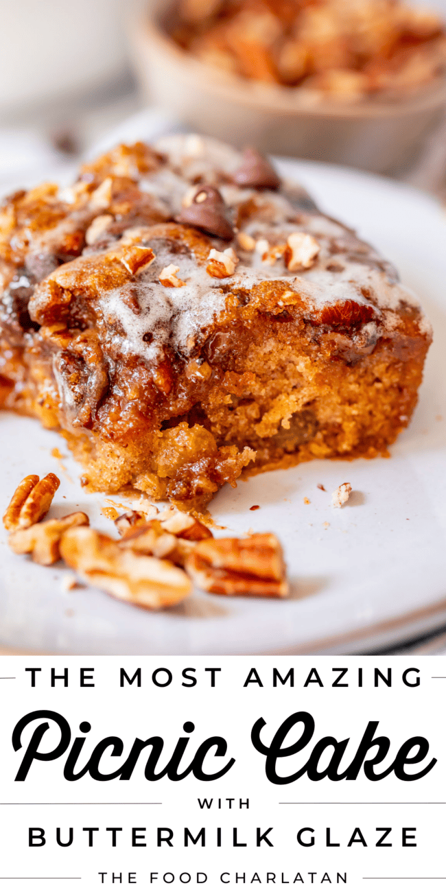 image of cut piece of picnic cake with a bite taken out of it with text "the most amazing picnic cake".