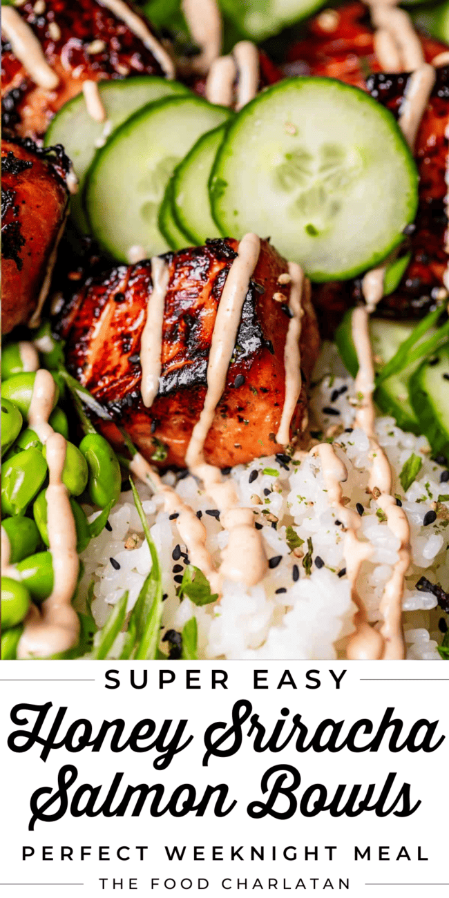 close up shot of blackened salmon drizzled with sriracha mayo, cucumbers in the background.