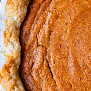 overhead shot looking down on a whole, baked sweet potato pie with no praline topping.