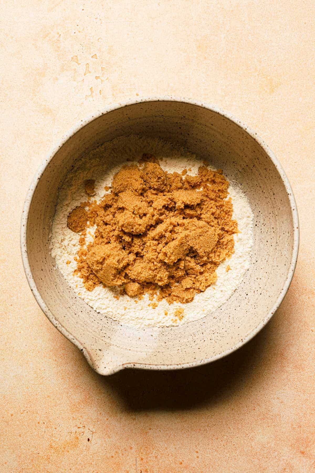 Flour, brown sugar, baking soda, baking powder, and salt in a mixing bowl.