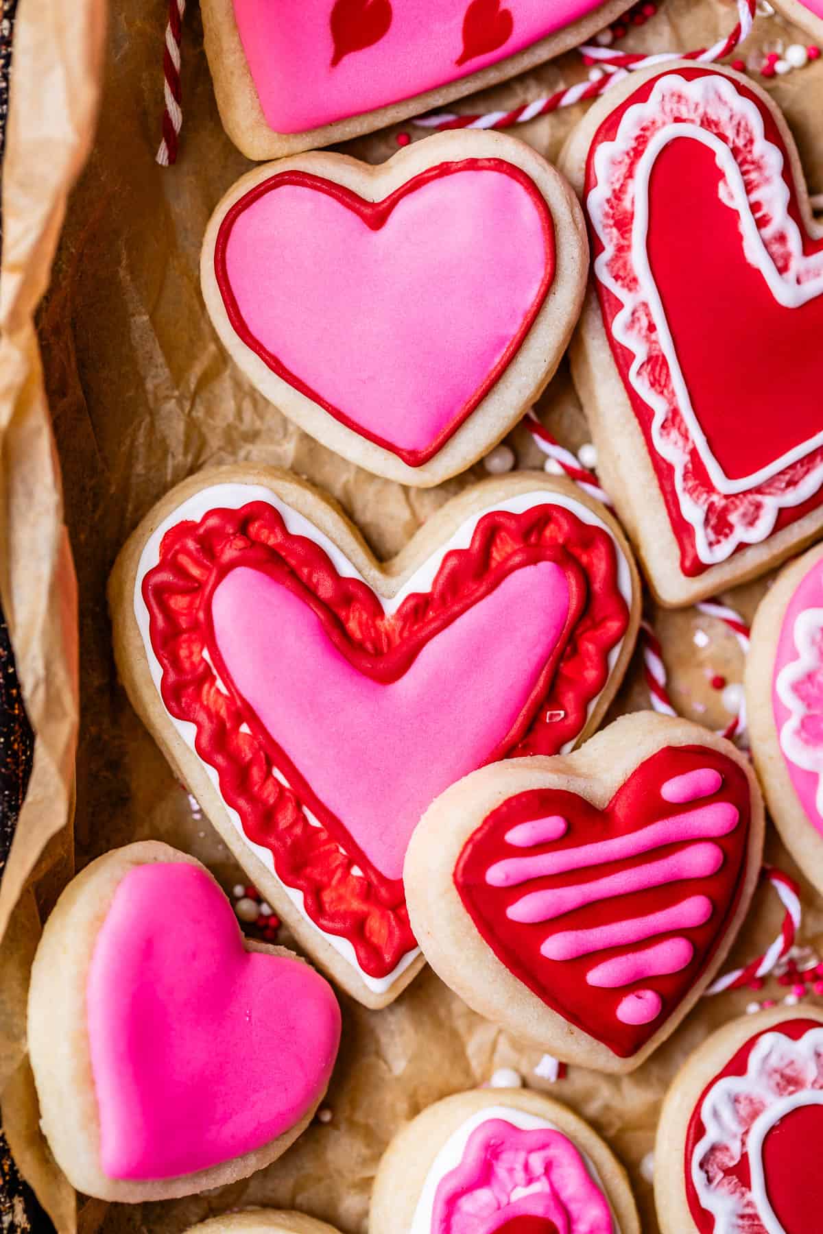 red and pink royal icing on sugar cookies.