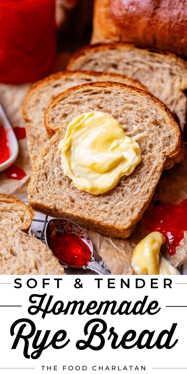 butter on a slice of rye bread with jam on the side.