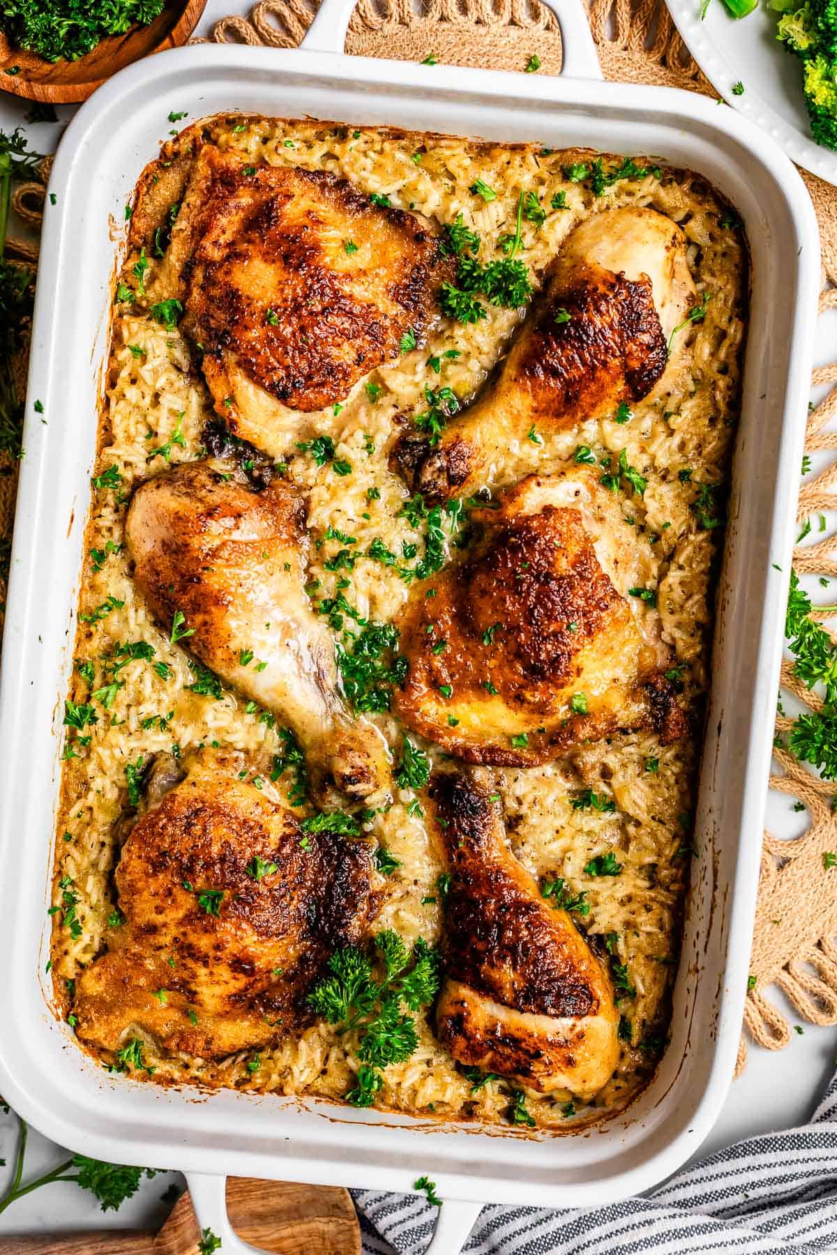 looking down on a chicken and rice casserole filled 9x13 ceramic dish.