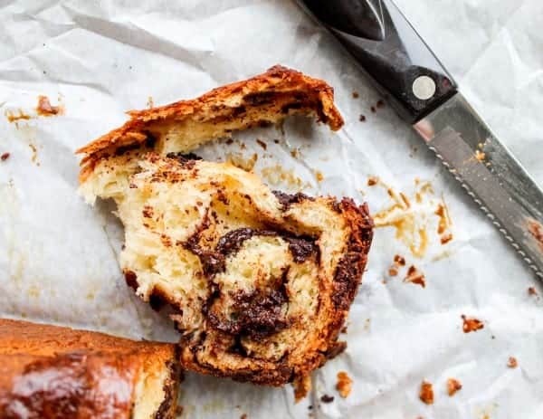 a torn slice of chocolate babka bread.